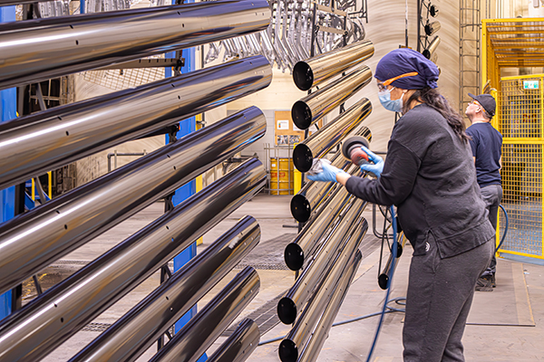 Employees Polishing Tubes