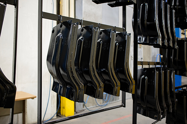 Black Metal Pieces hanging on rack