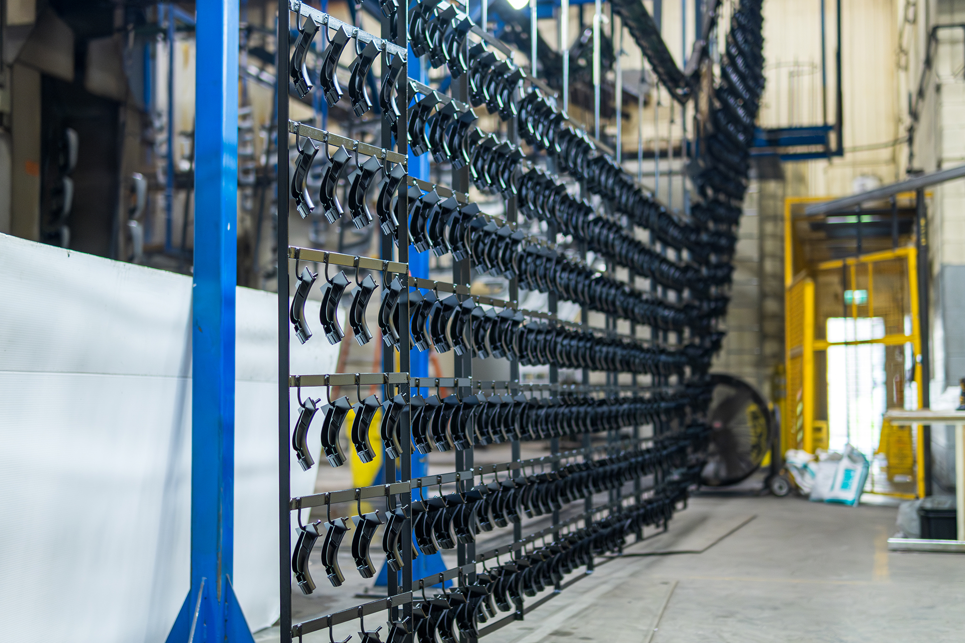 Tiny Black Metal Parts on the Line